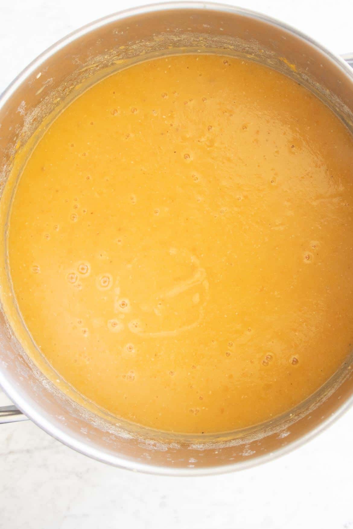 mixing the shorbat adas soup