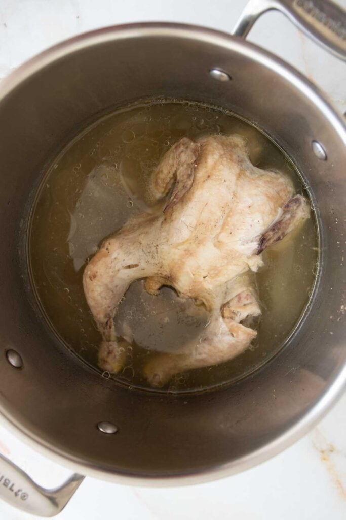 the whole chicken cooked in the pot
