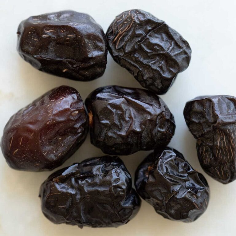 ajwa dates on a table