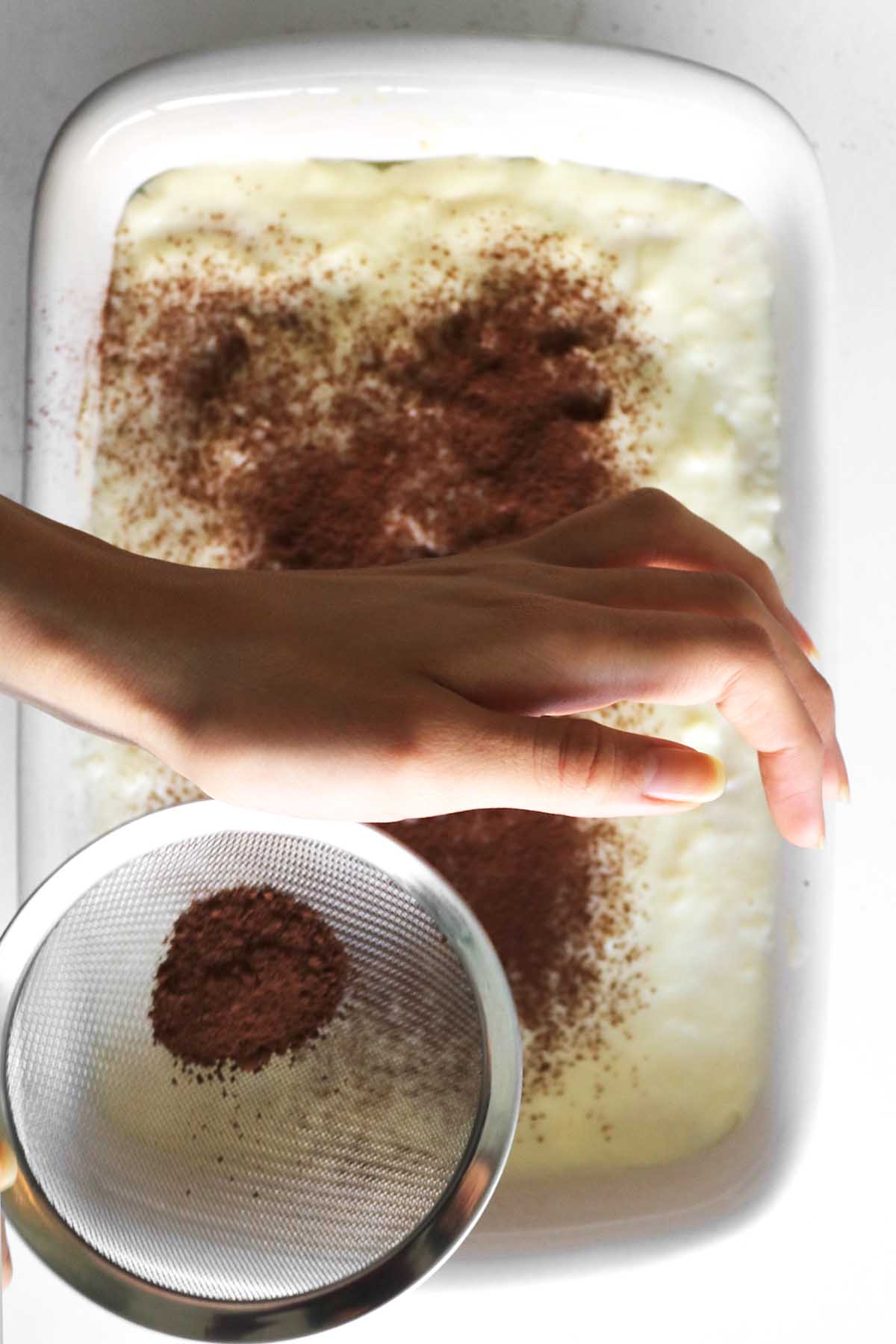 sprinkling cocoa and coffee on top