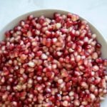 pomegranate arils close up in a bowl