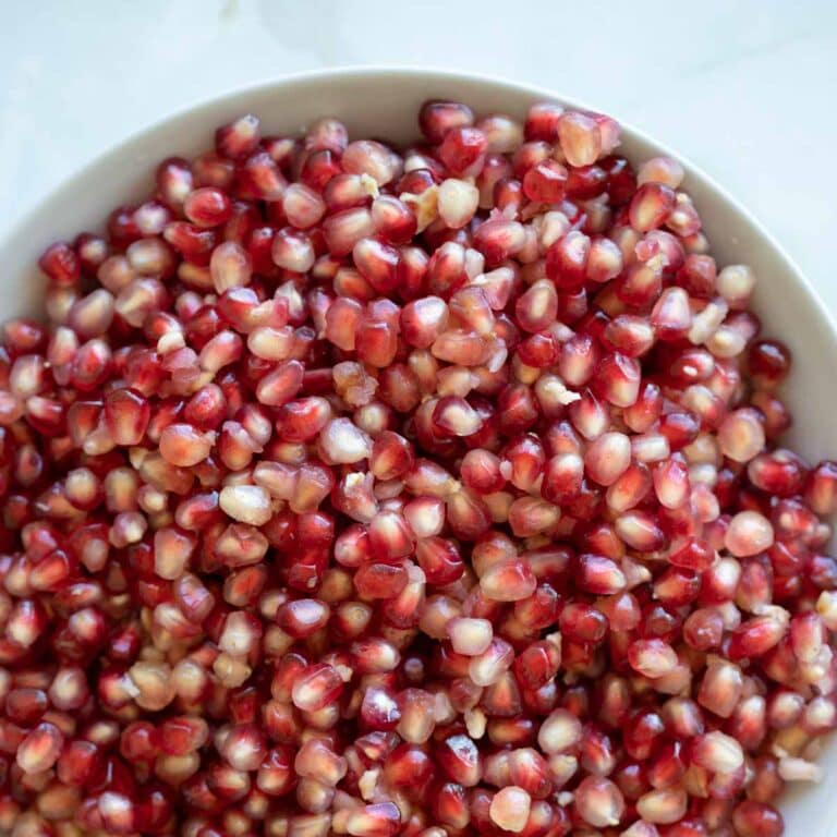 pomegranate arils close up in a bowl