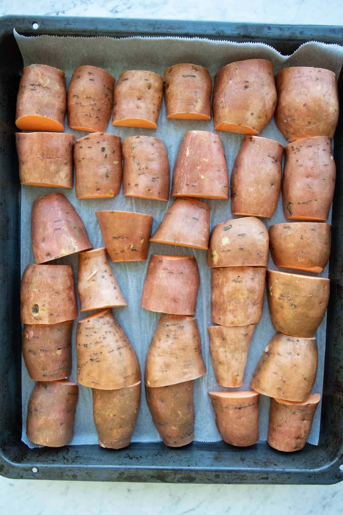 sweet potato wedges on a baking tray