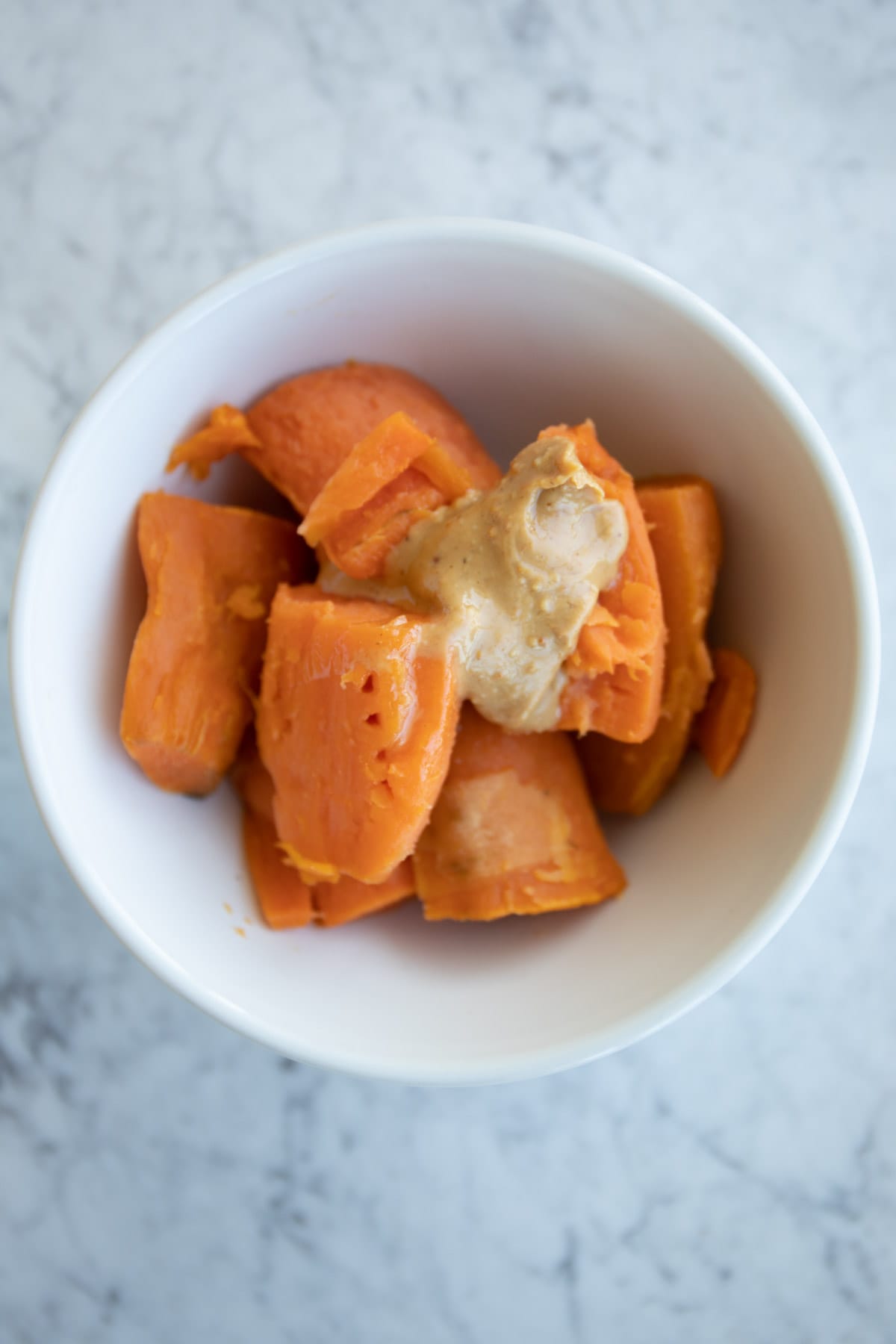 sweet potatoes with almond butter in a bowl