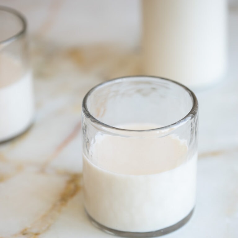 close up of almond milk in a cup