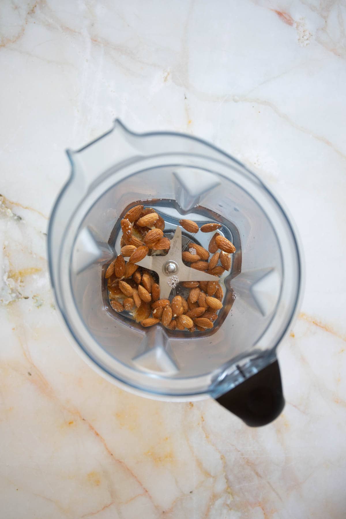 add half of the water to the vitamix blender