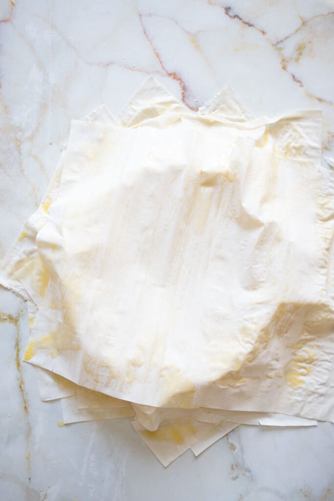 rotating a filo sheet and laying on top of the other filo sheets