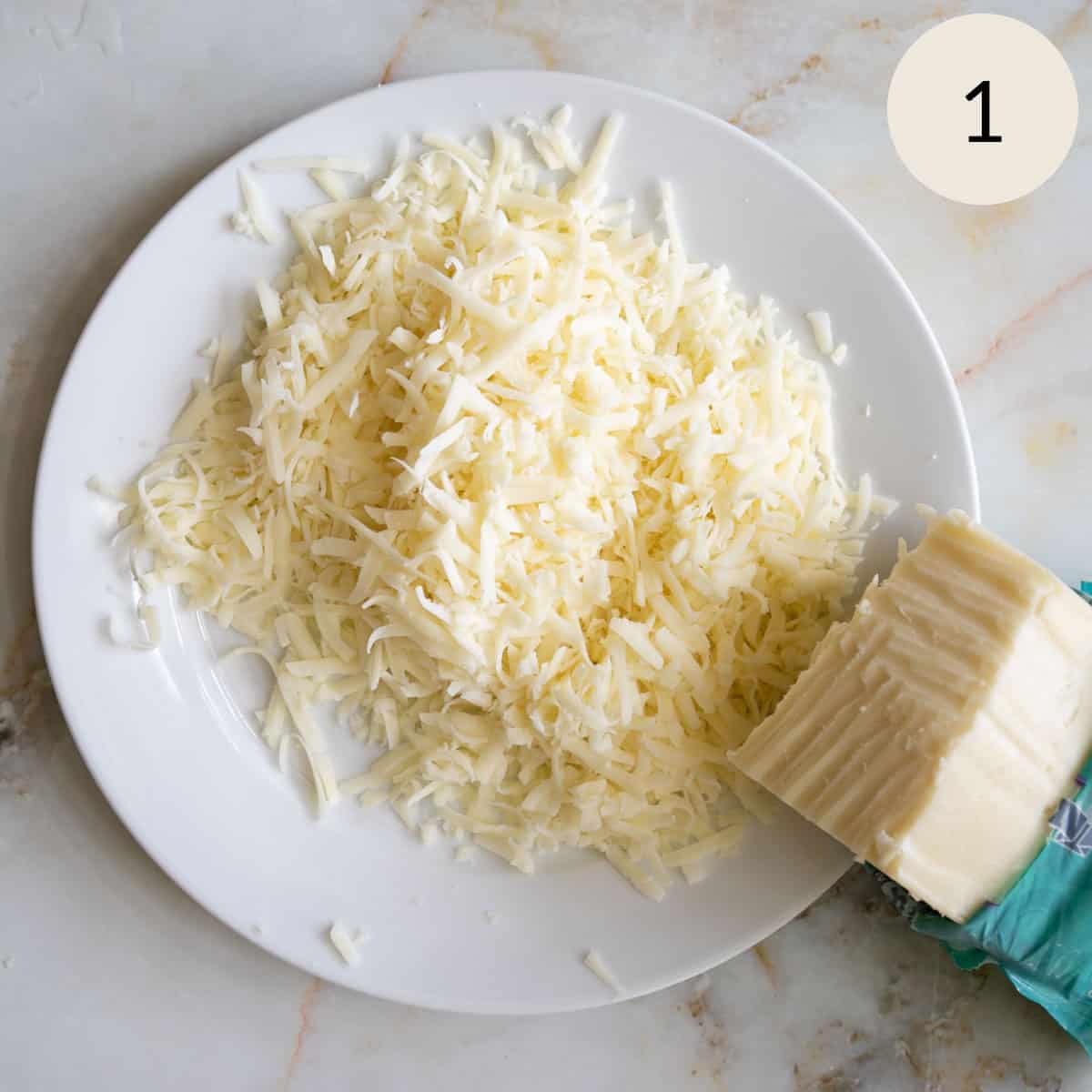 Shredding a block of mozzarella cheese