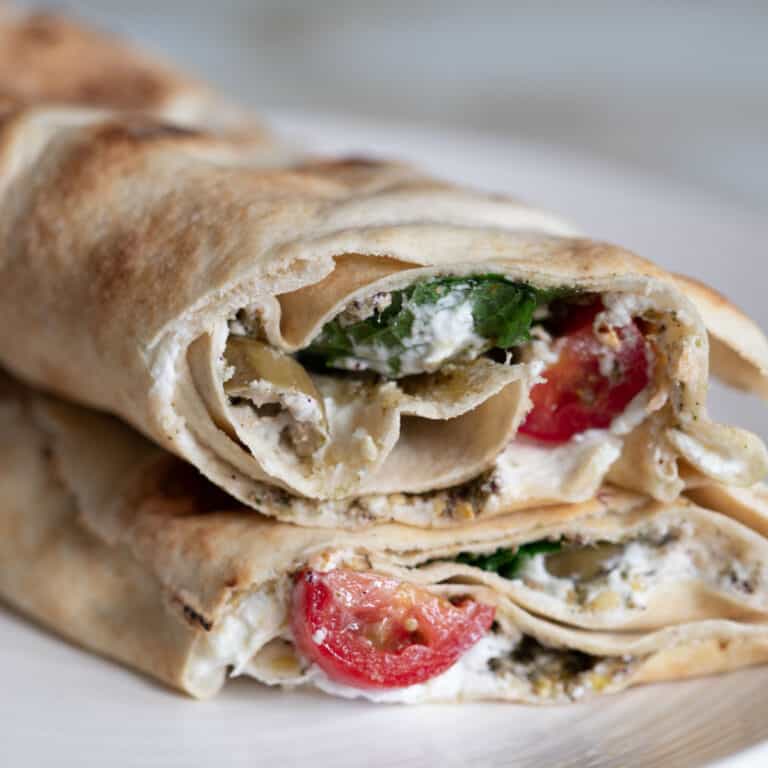 labneh pita sandwich cut in half on a plate