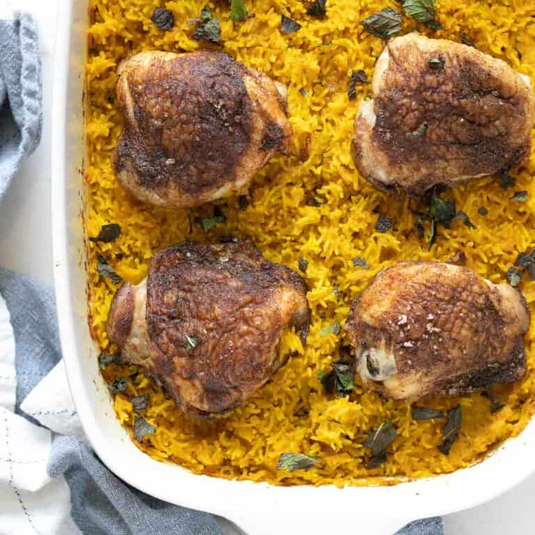 chicken thighs and turmeric basmati rice on the counter