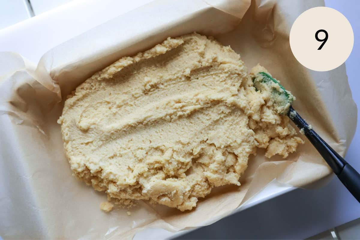 add the semolina cake batter to a parchment lined baking dish