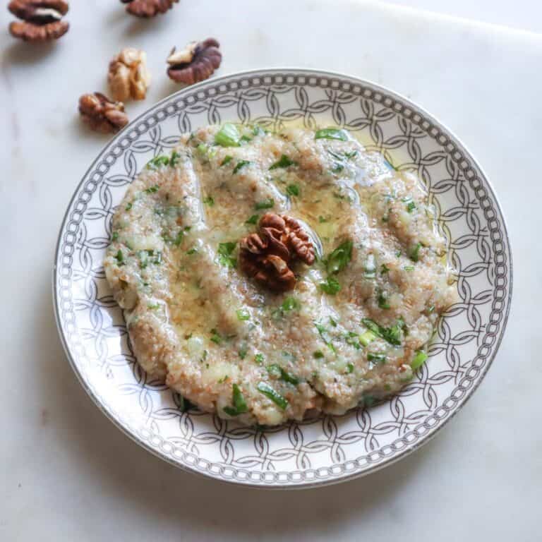 potato kibbeh on a plate with olive oil