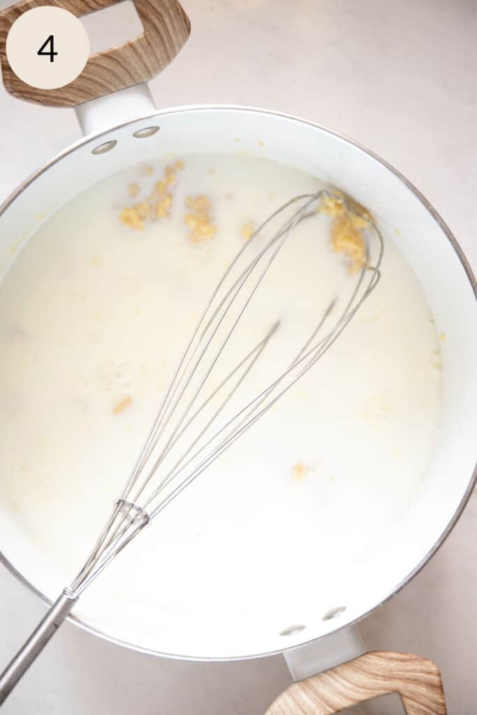 add the milk to the butter and flour roux