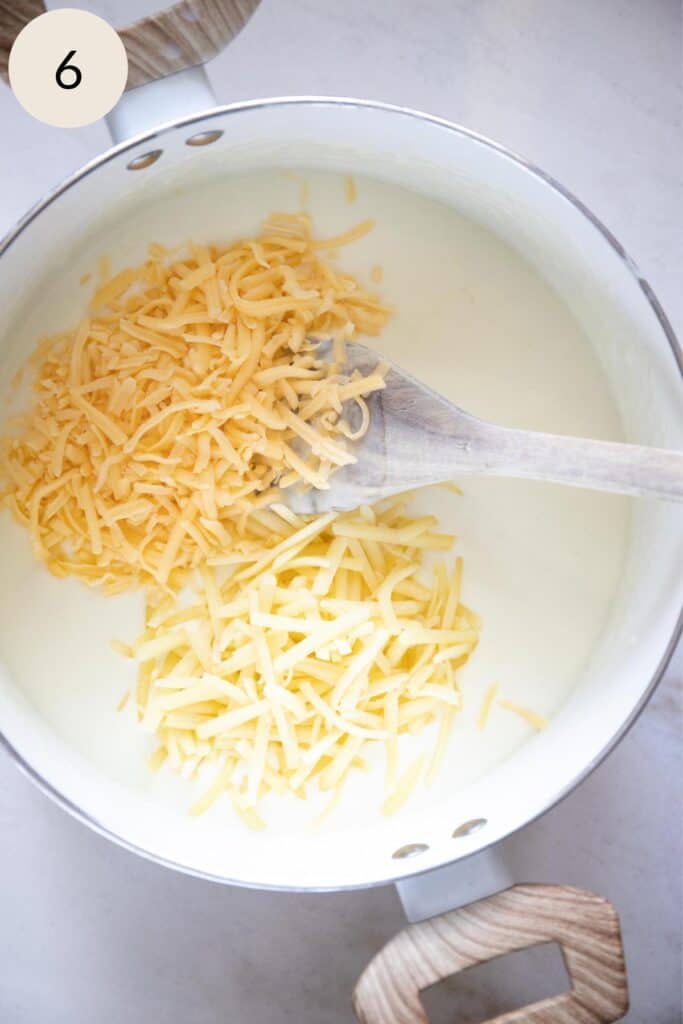add the shredded gouda and shredded sharp cheddar cheese