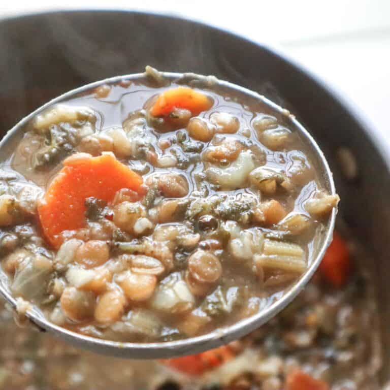 lentil soup adas bi hamod in a spoon.