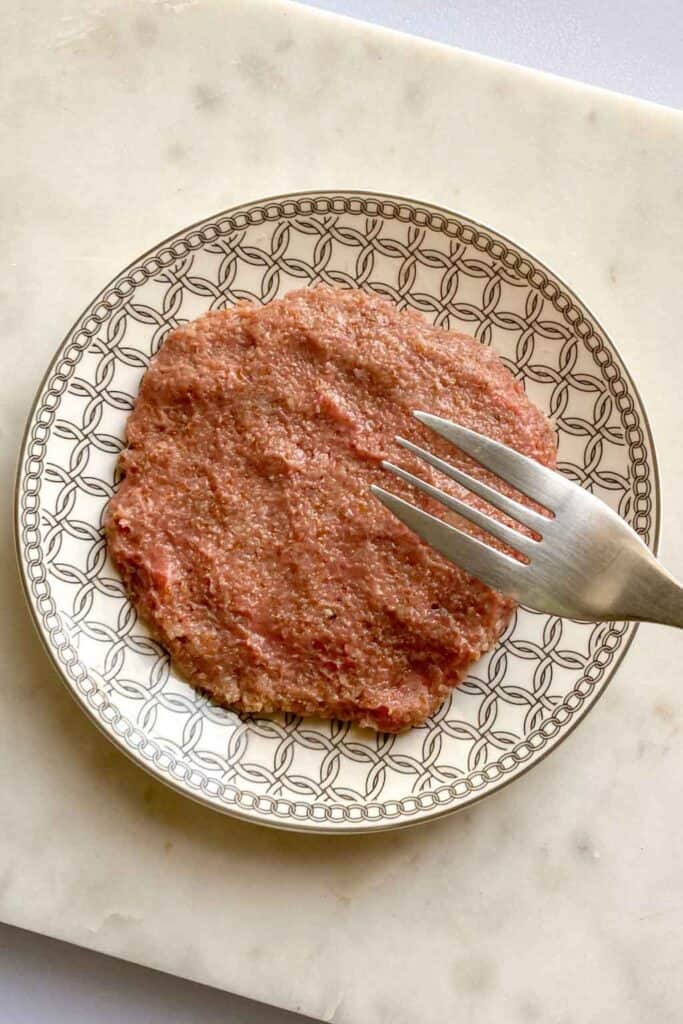 using a fork to make indentations in the raw kibbeh