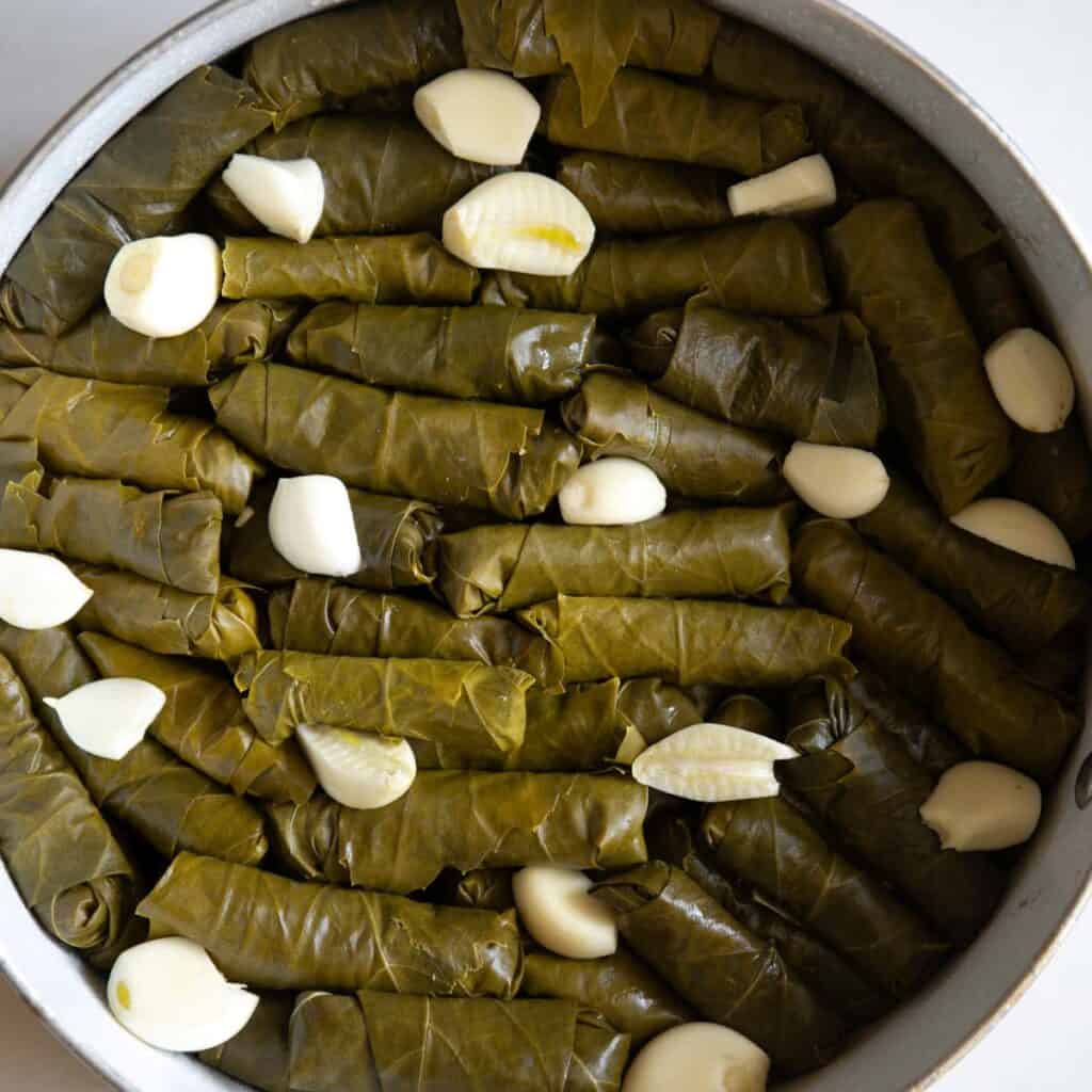 add some garlic cloves in between
