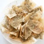 close up view of fried pita chips with zaatar spice