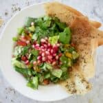 fatoosh chopped salad with pomegranate and pita chips