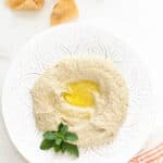 fire roasted baba ganoush on a plate with olive oil