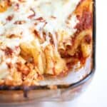 close up view of a cheese pull from the baked ziti