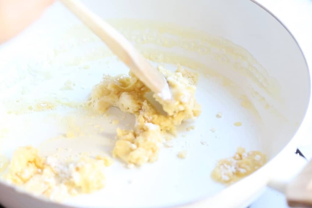 Creamy béchamel sauce being prepared