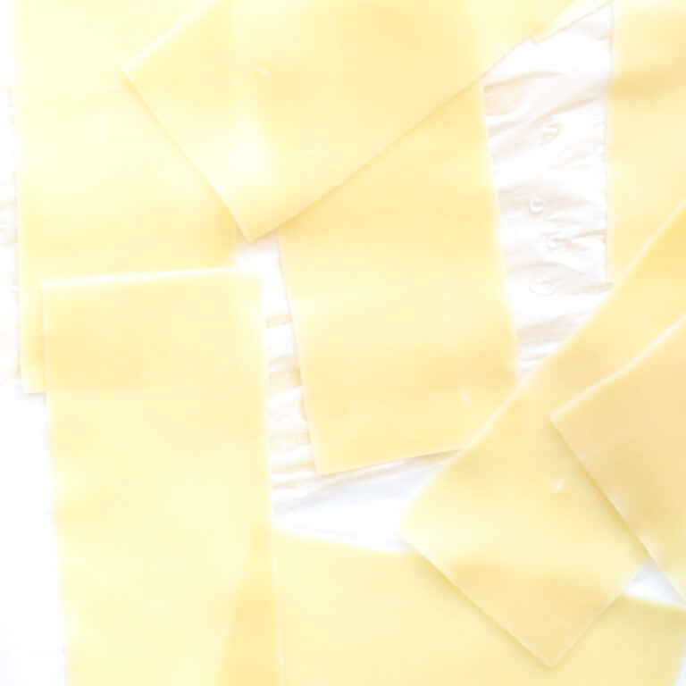 boiled oven-ready lasagna sheets on parchment paper