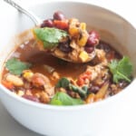 one-pot turkey chili in a bowl with a spoon.