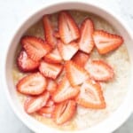 the best protein oatmeal with mashed banana and sliced strawberries