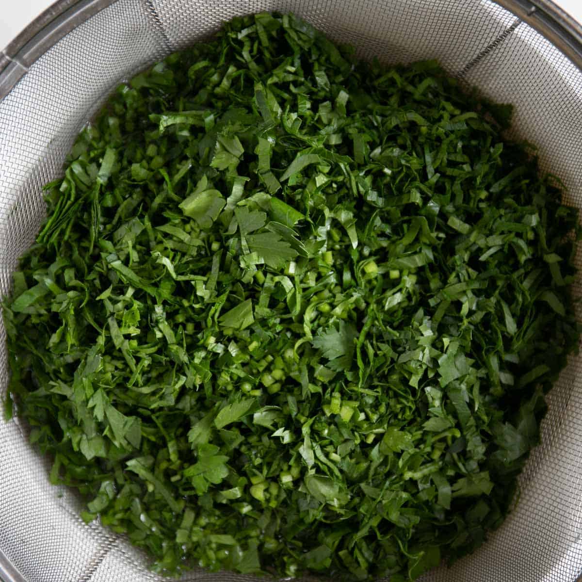 chopped parsley in a strainer.