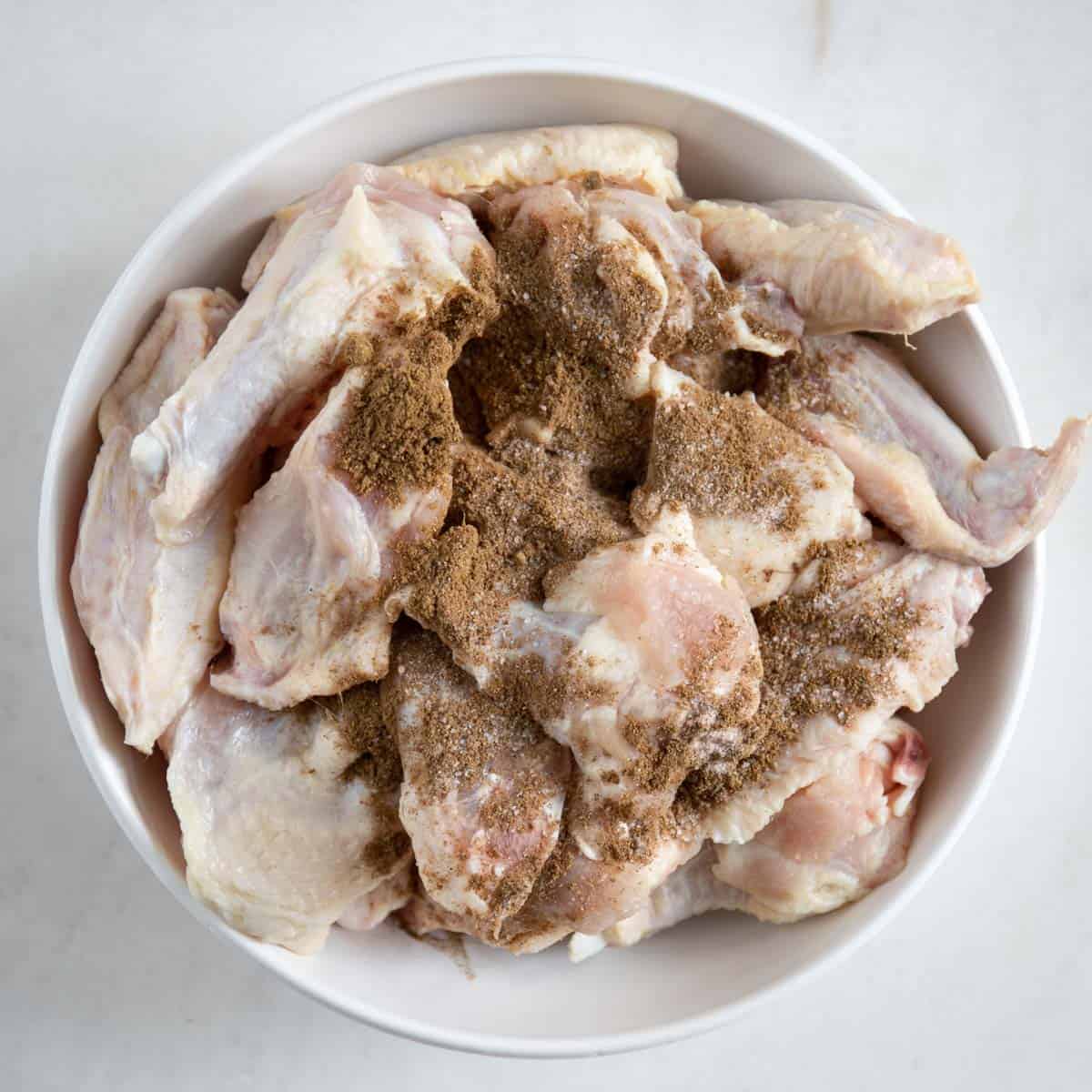 dry seasoning and salt added to the chicken wings.