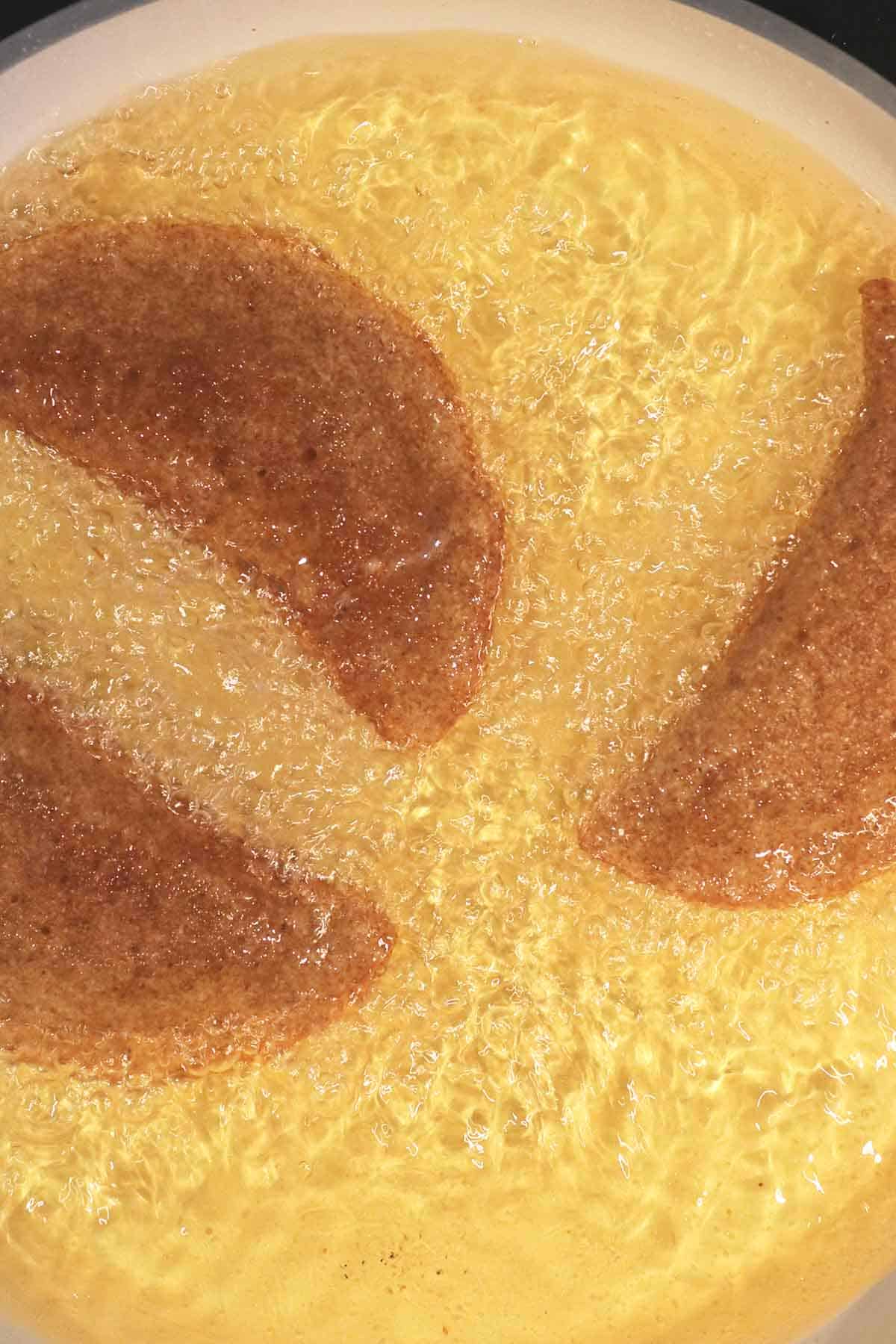 deep-frying atayef in oil.