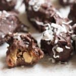 a side view of the dark chocolate almond covered dates.
