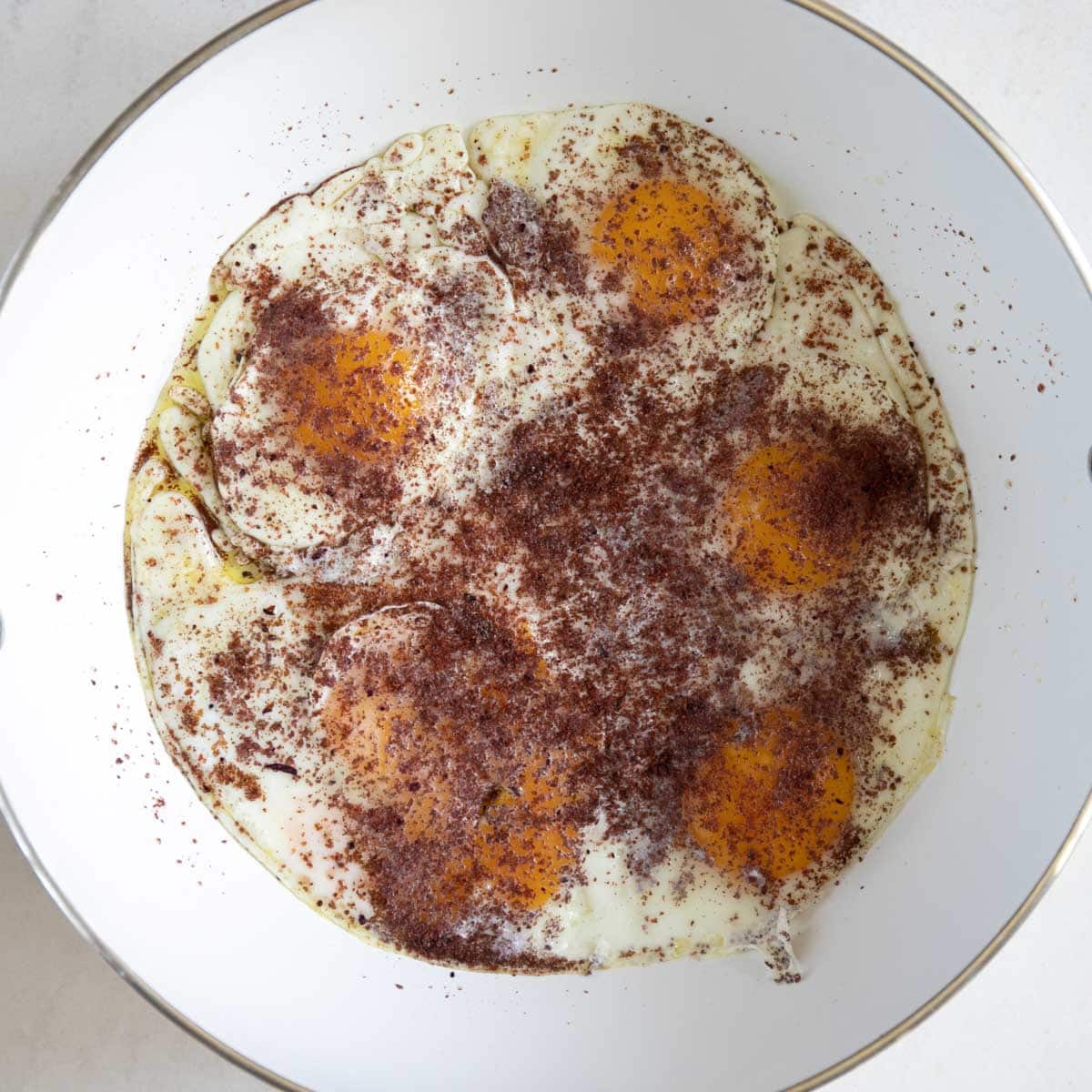 sumac sprinkled on top of fried eggs