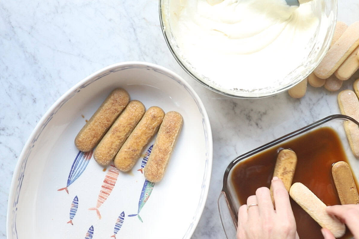 Assembling the tiramisu.