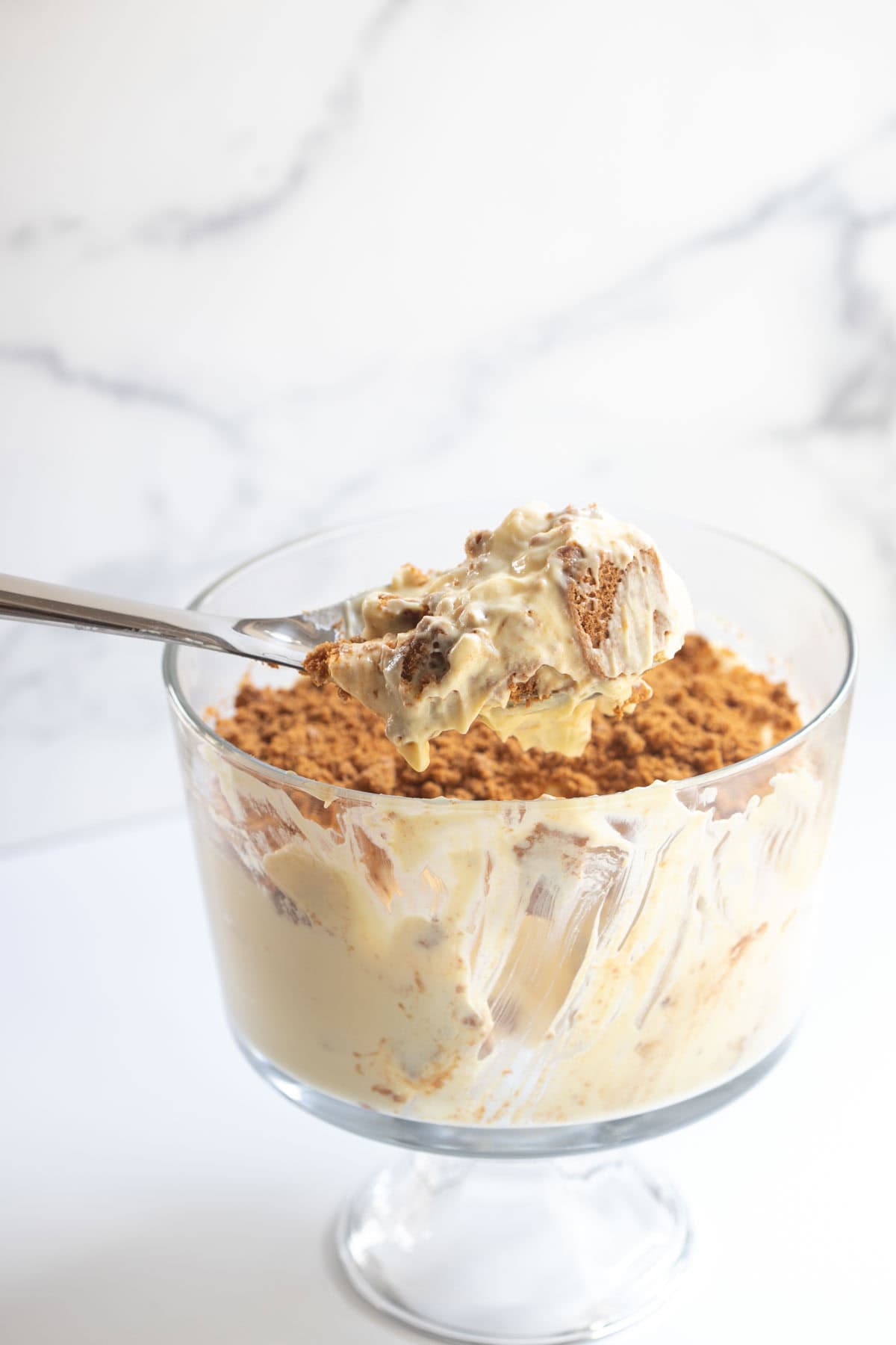 biscoff banana pudding on a large serving spoon.