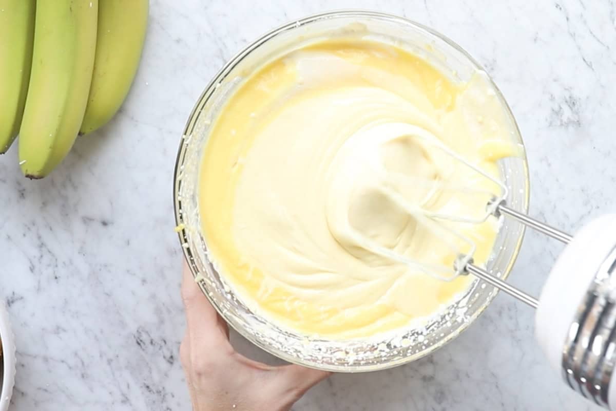 Whisk together the vanilla pudding, whipped cream, cream cheese, and condensed milk.