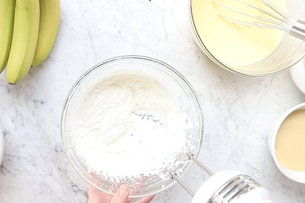 Whip the heavy cream in a bowl with an electric mixer.