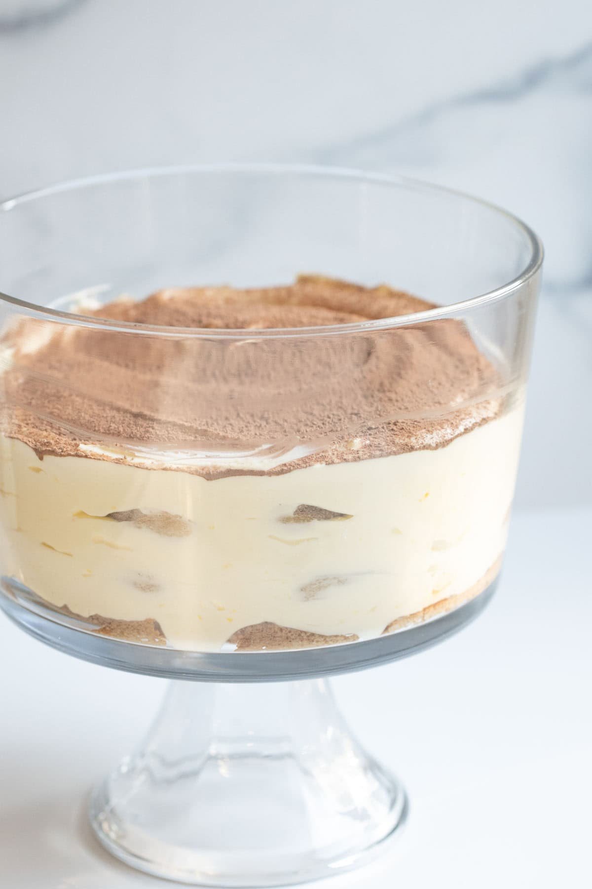 tiramisu in a trifle dessert bowl.