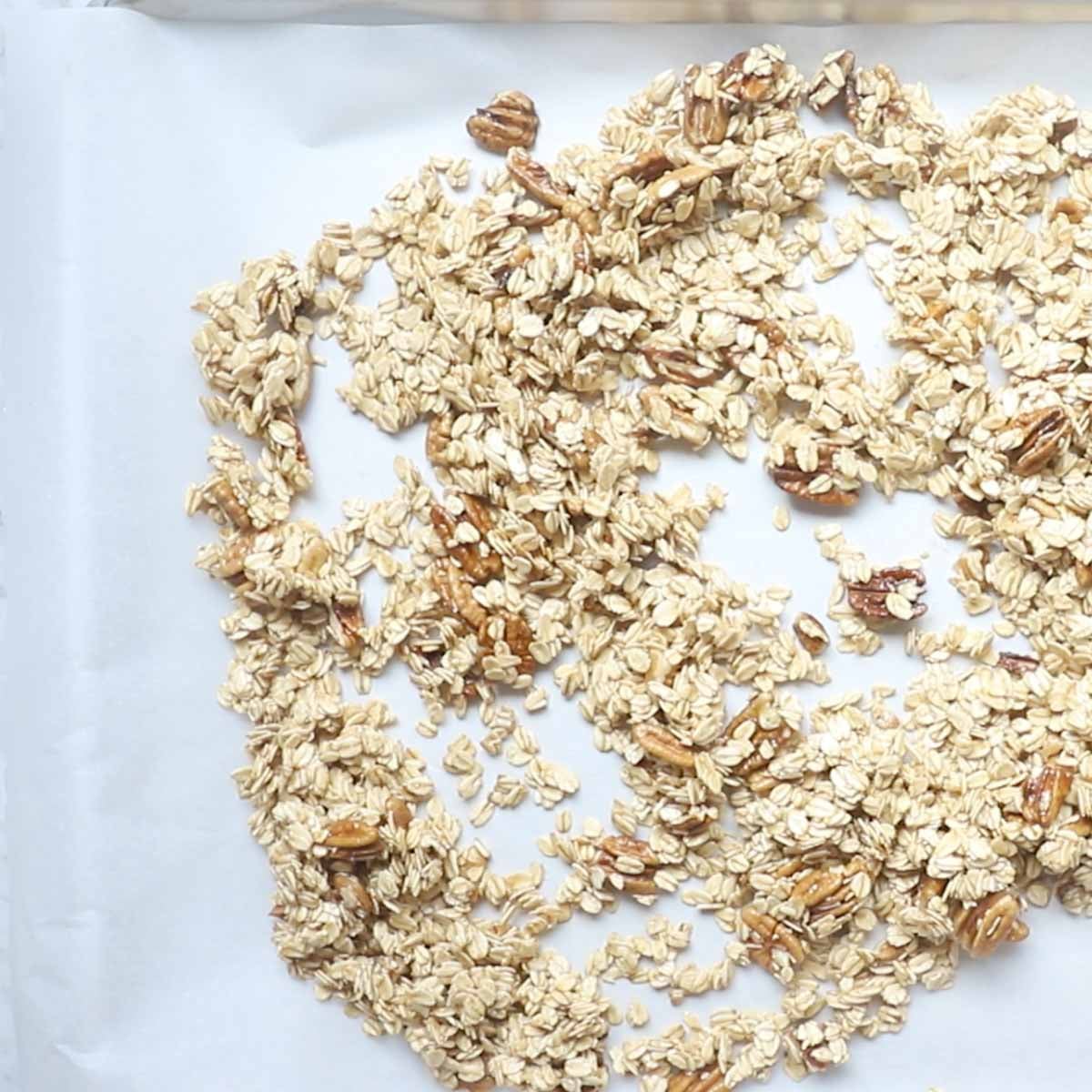 spreading the granola mixture on a baking sheet.