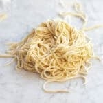 homemade spaghetti noodles from scratch dusted with flour.
