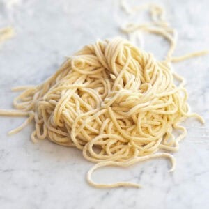 homemade spaghetti noodles from scratch dusted with flour.