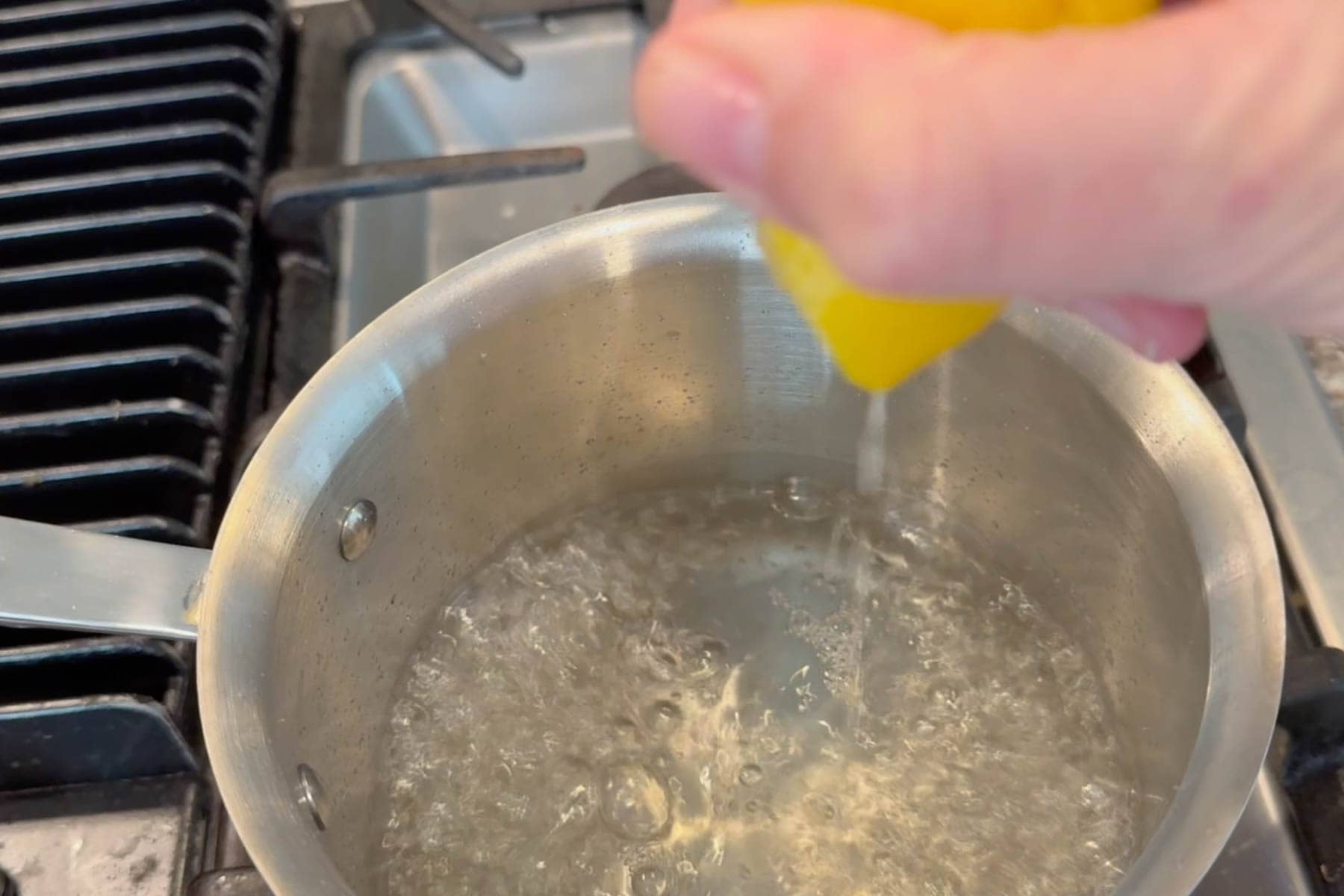 squeezing lemon juice in the simple sugar syrup.