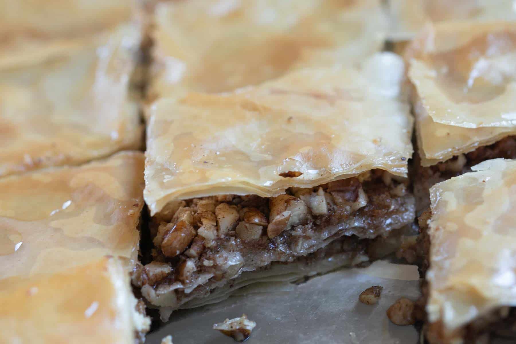 close up view of crushed pecan baklava.