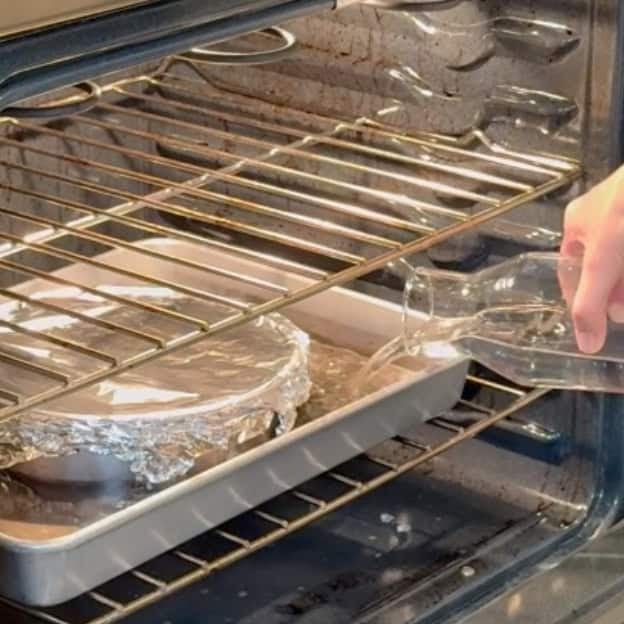 adding water to the water bath for the creme caramel.