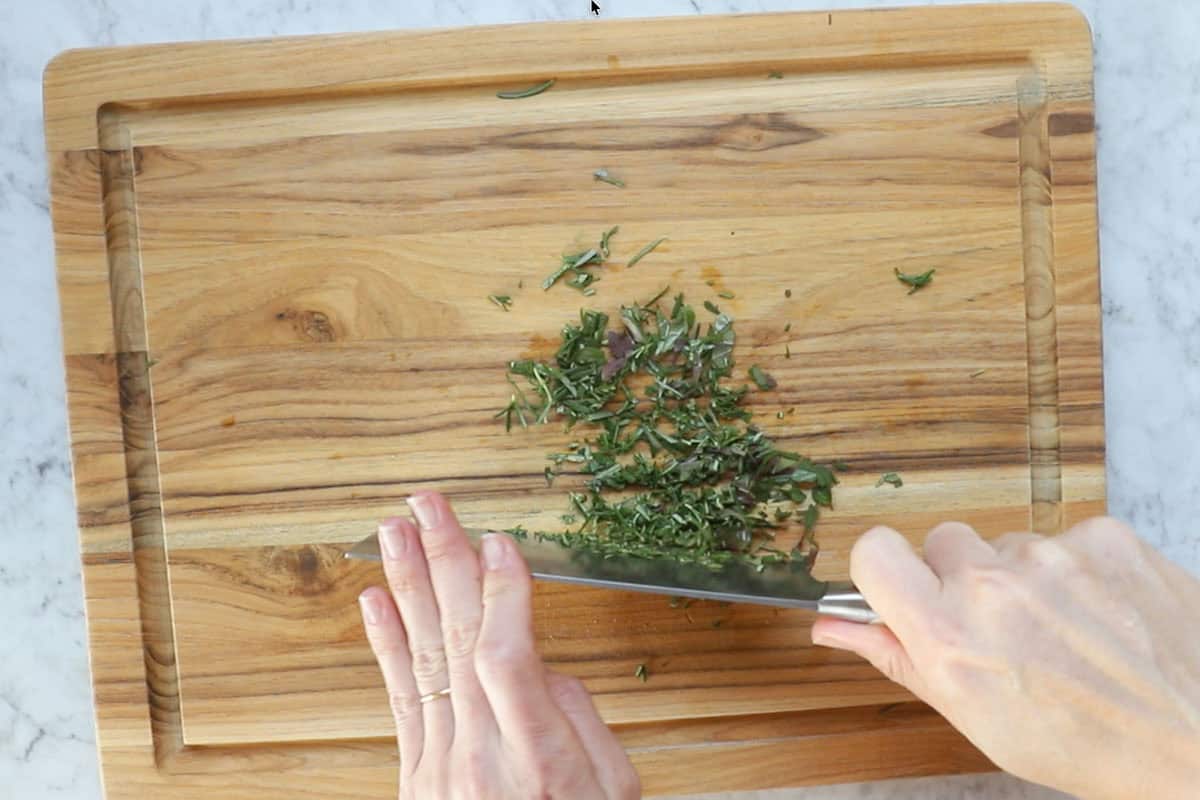 chopping fresh herbs.