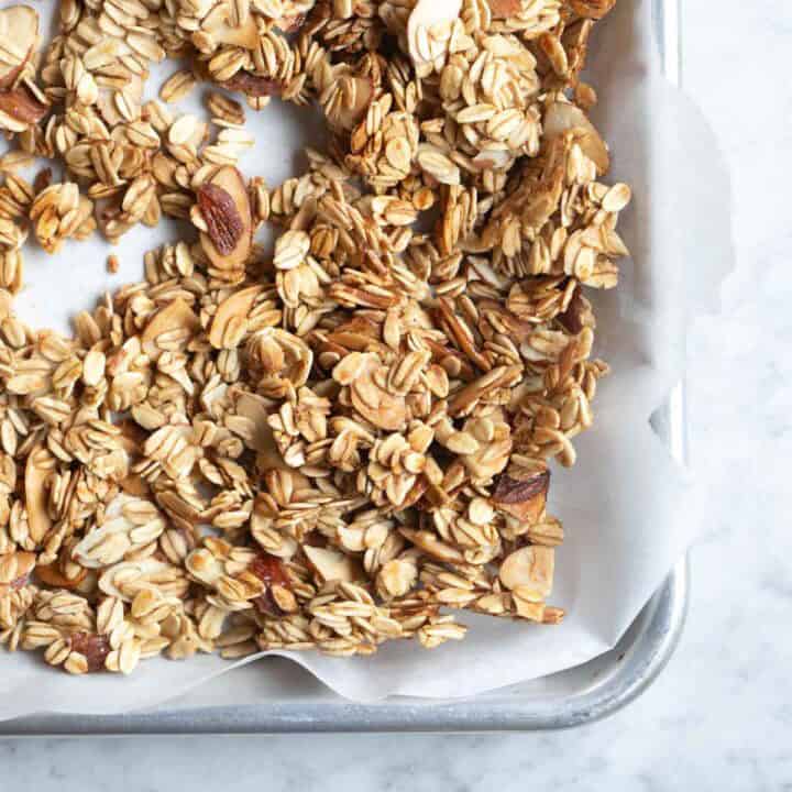 vanilla almond granola in a baking sheet.