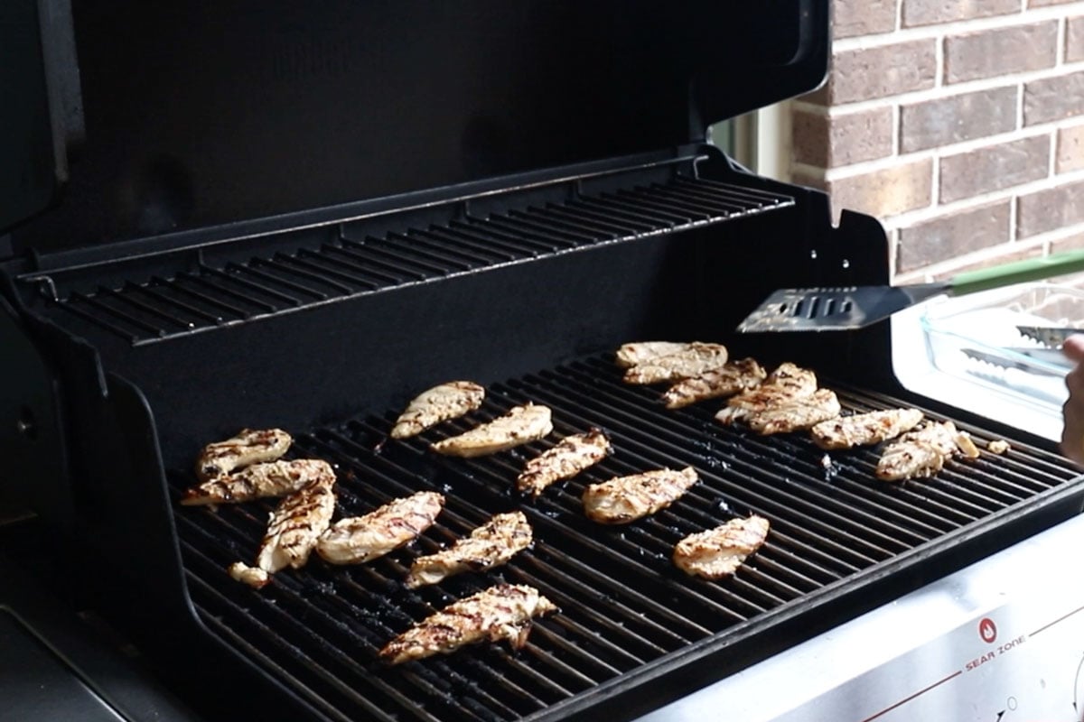 marinated chicken tenders on the grill.