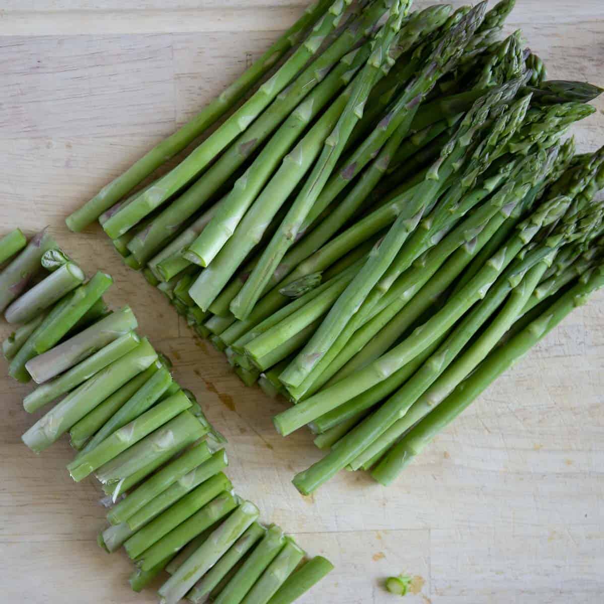 cutting the bottom ends off of the asparagus spears.