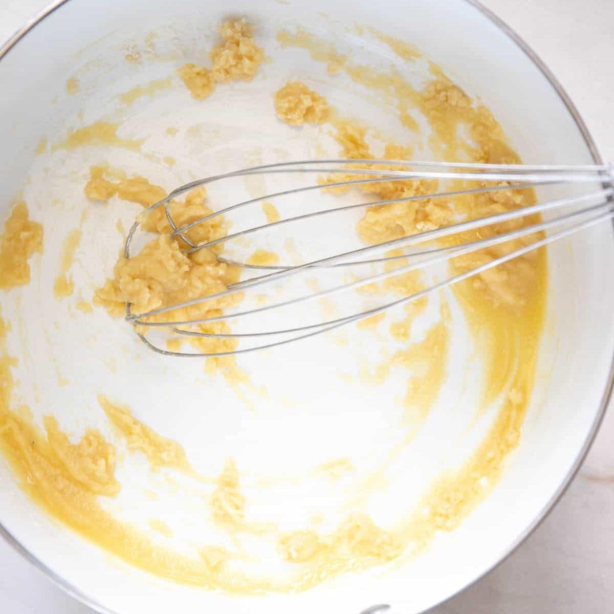 whisk the melted butter and flour together to form a roux.